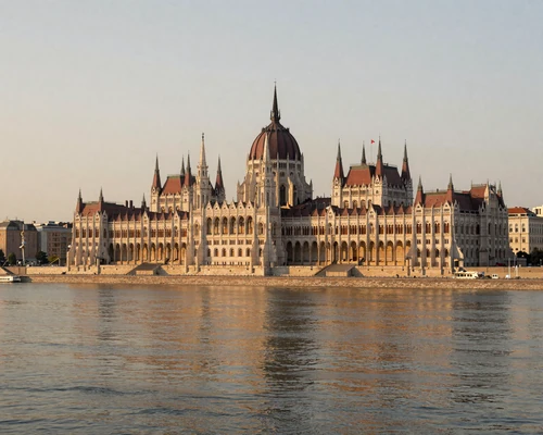 Beautiful Budapest Parliament building along the Danube River at sunset, showcasing Hungary's stunning architecture